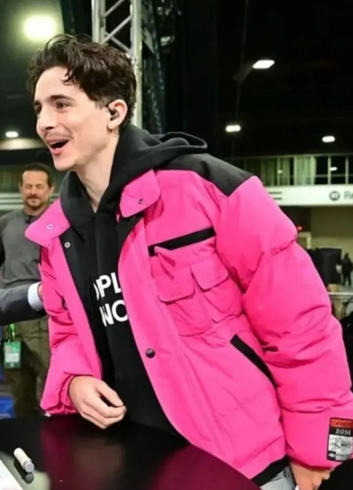 college-gameday-timothee-chalamet-pink-puffer-jacket.webp