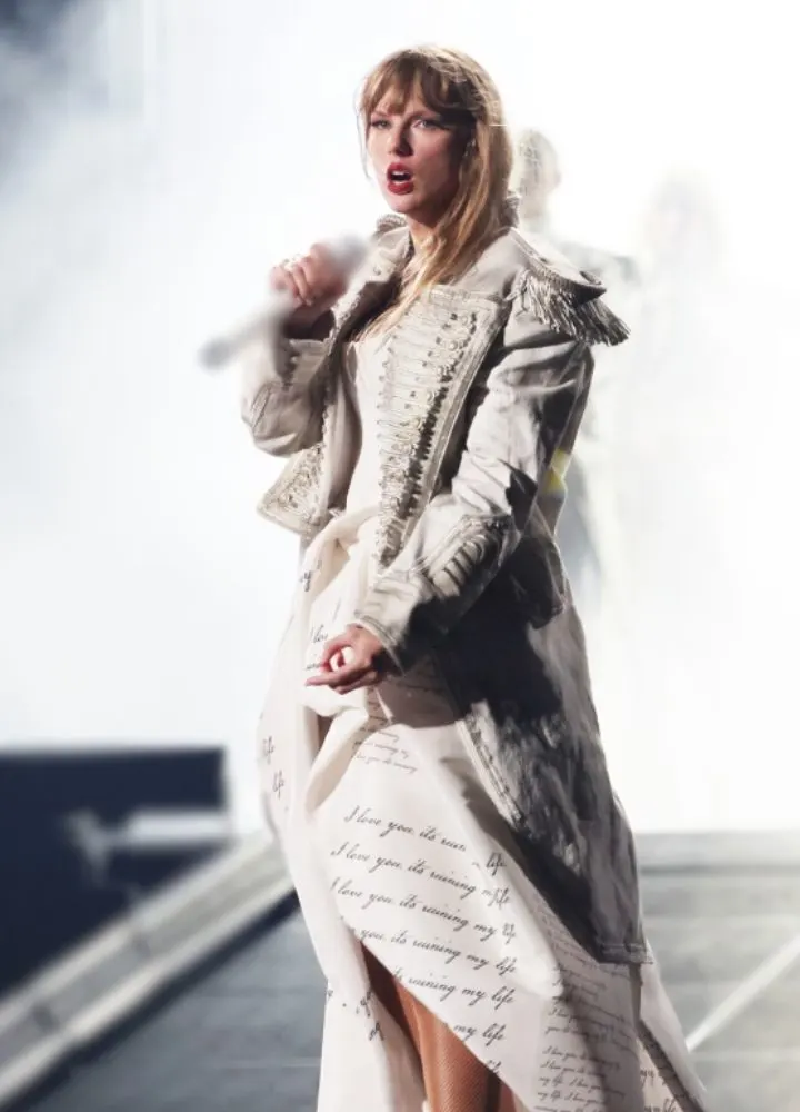 taylor-swift-paris-eras-tour-2024-white-fringe-coat.webp
